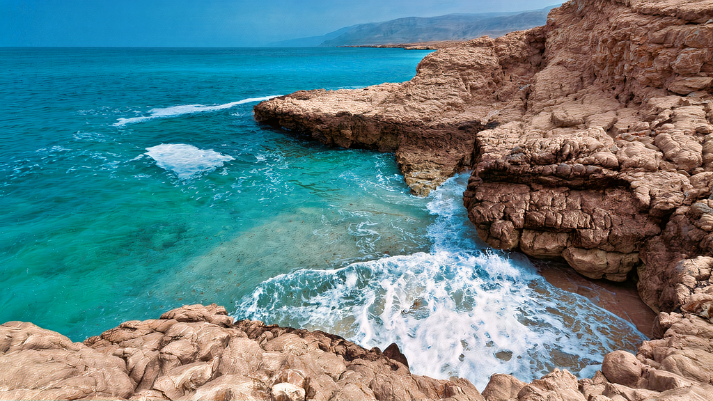 Idyllic Fins Beach, with its pristine white sands, azure waters, and picturesque rocky outcrops.