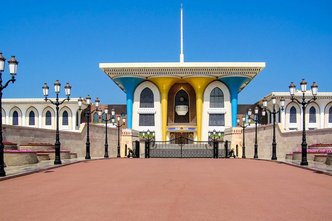 Majestic Al Alam Palace in Muscat, Oman, with its golden gates, grand domes, and imposing presence.