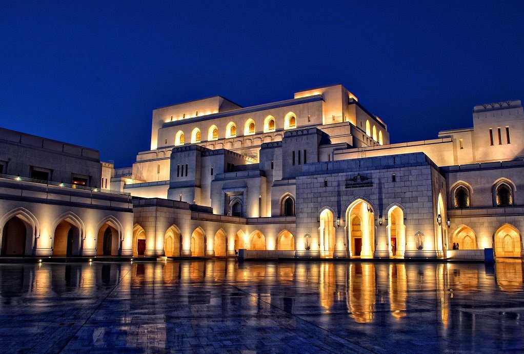 The stunning Royal Opera House in Muscat, Oman, featuring elegant Islamic-inspired architecture and manicured gardens, a must-visit landmark on the Muscat City Tour.
