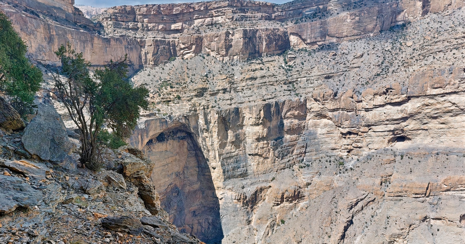 Hikers on the W6 Balcony Trail, surrounded by breathtaking mountain vistas and rocky terrain.